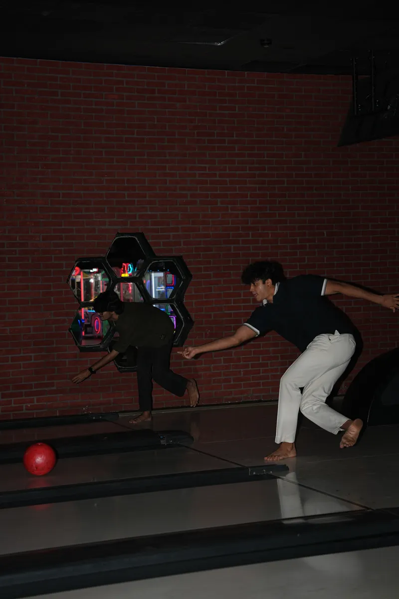 A bowler mid-throw at Strike Social